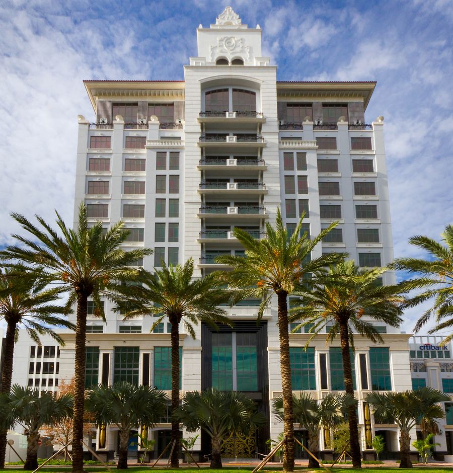 front building entrance with palm trees